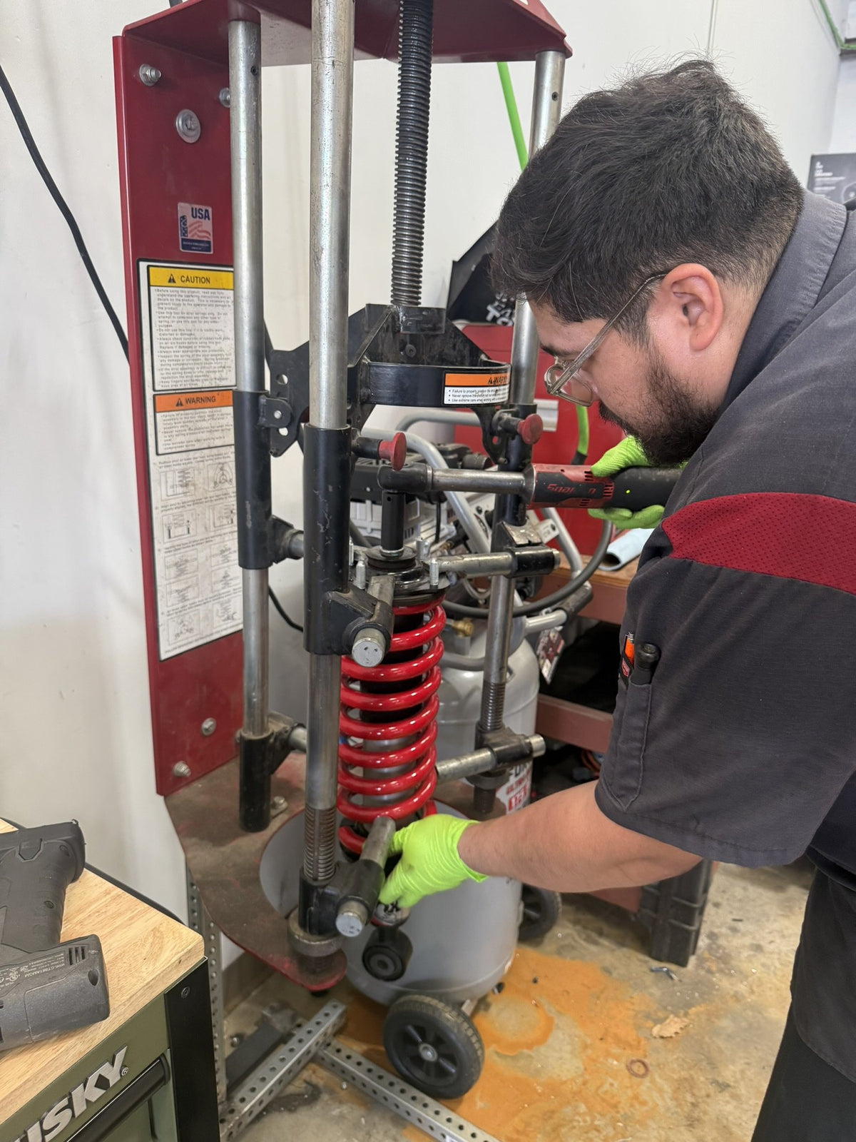 Trailmark technician building a coilover