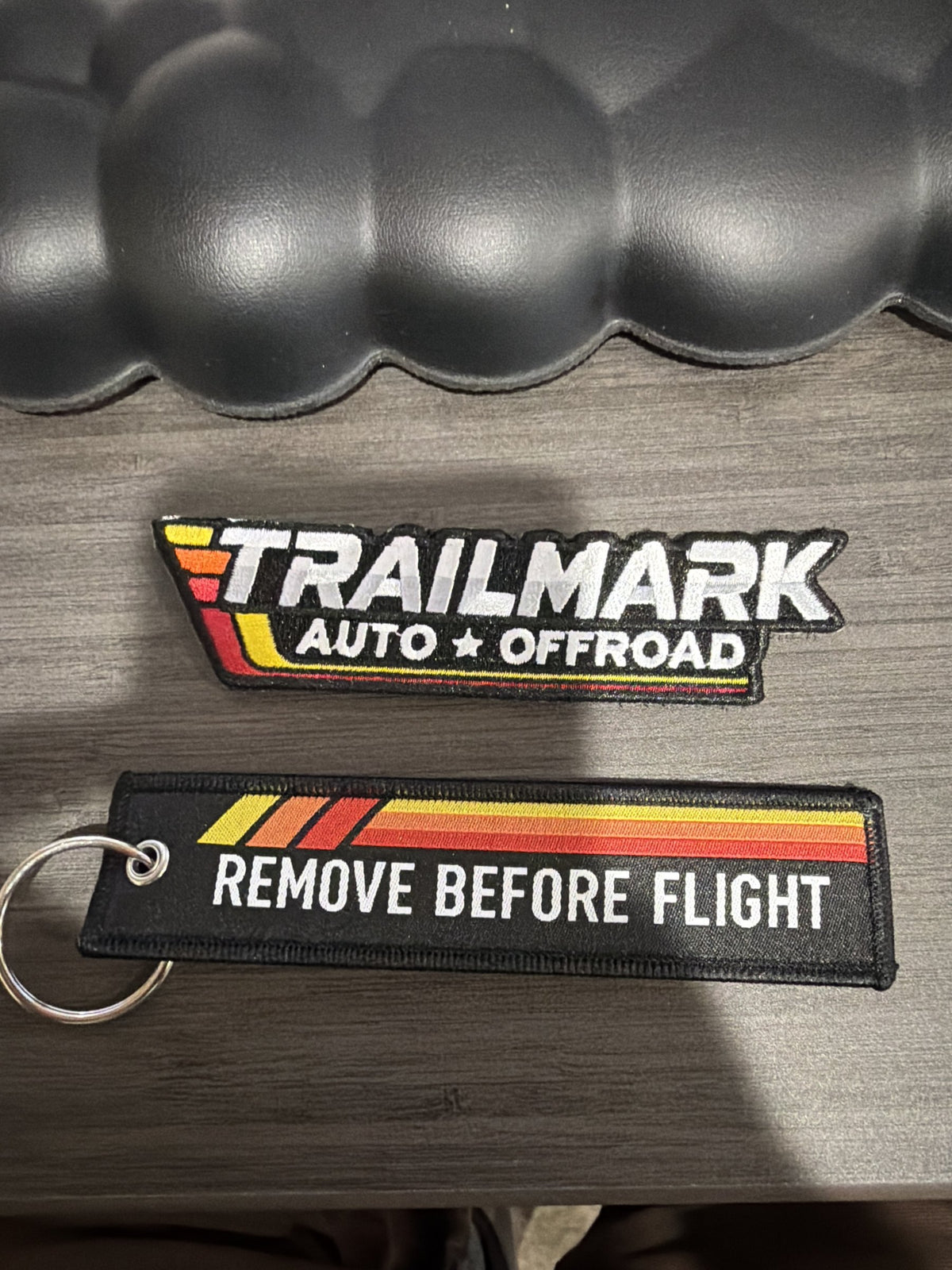 Trailmark patch and Remove Before Flight keychain