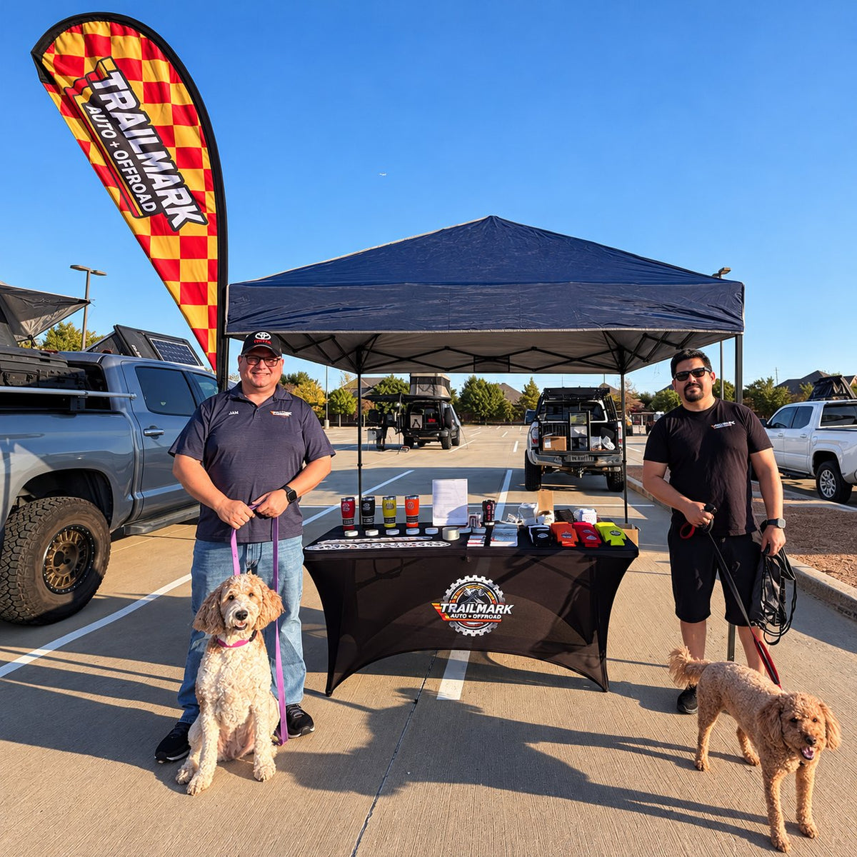 Trailmark team at the event booth with their dogs