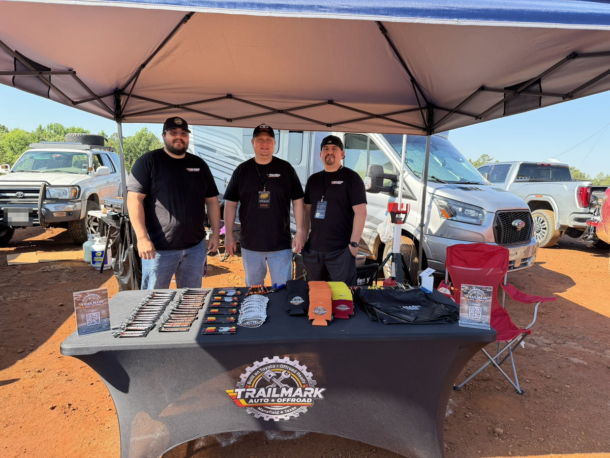 The Trailmark team at the event booth at an off-road park